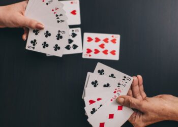 Balancing the Meta with Algorithms: How Evolutionary Models Tweak Card Power